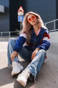 modern retro style 90s, girl in a blue sports jacket.